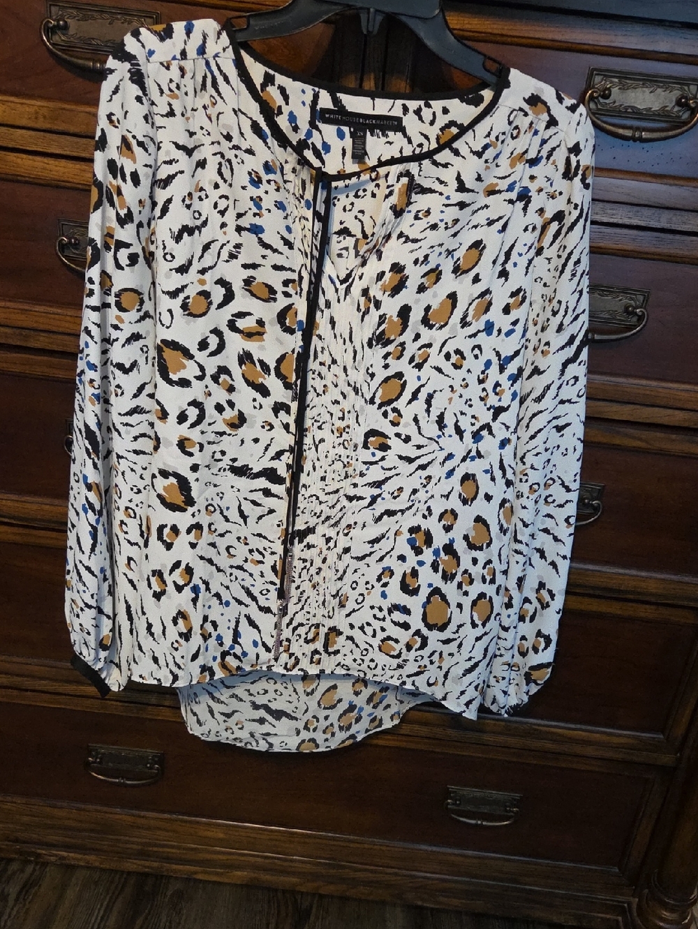 White House Black Market White Animal-Print Long-Sleeve Blouse with Black Trim.